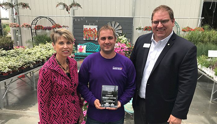 Sandy Ehrig, Iowa Farm Bureau economic development administrator (left); Kyle Canoyer (center); Brian Buethe, Grimes Chamber of Commerce president (right) 