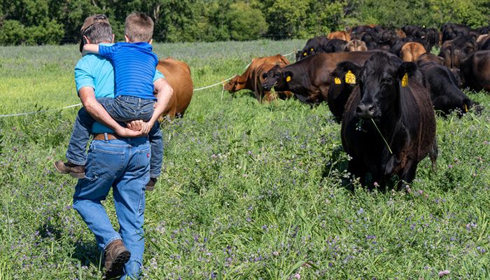 Farmer giving grandson piggyback ride